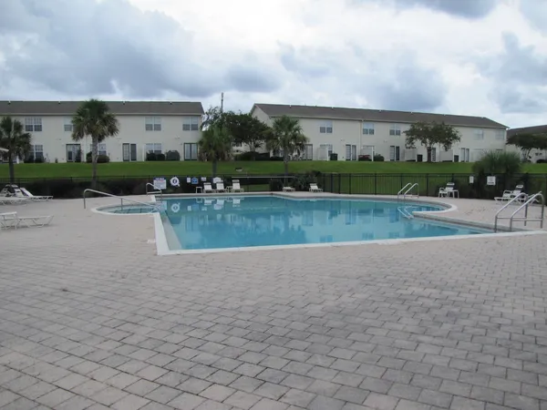 a view of swimming pool and front of buildings