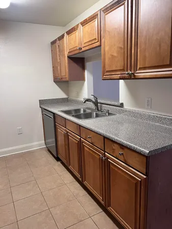 a kitchen with a sink and cabinets