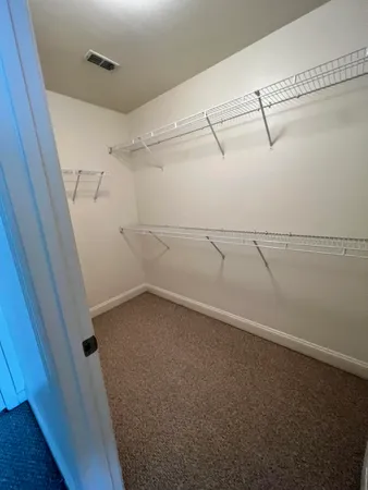a view of a room with racks on the wall