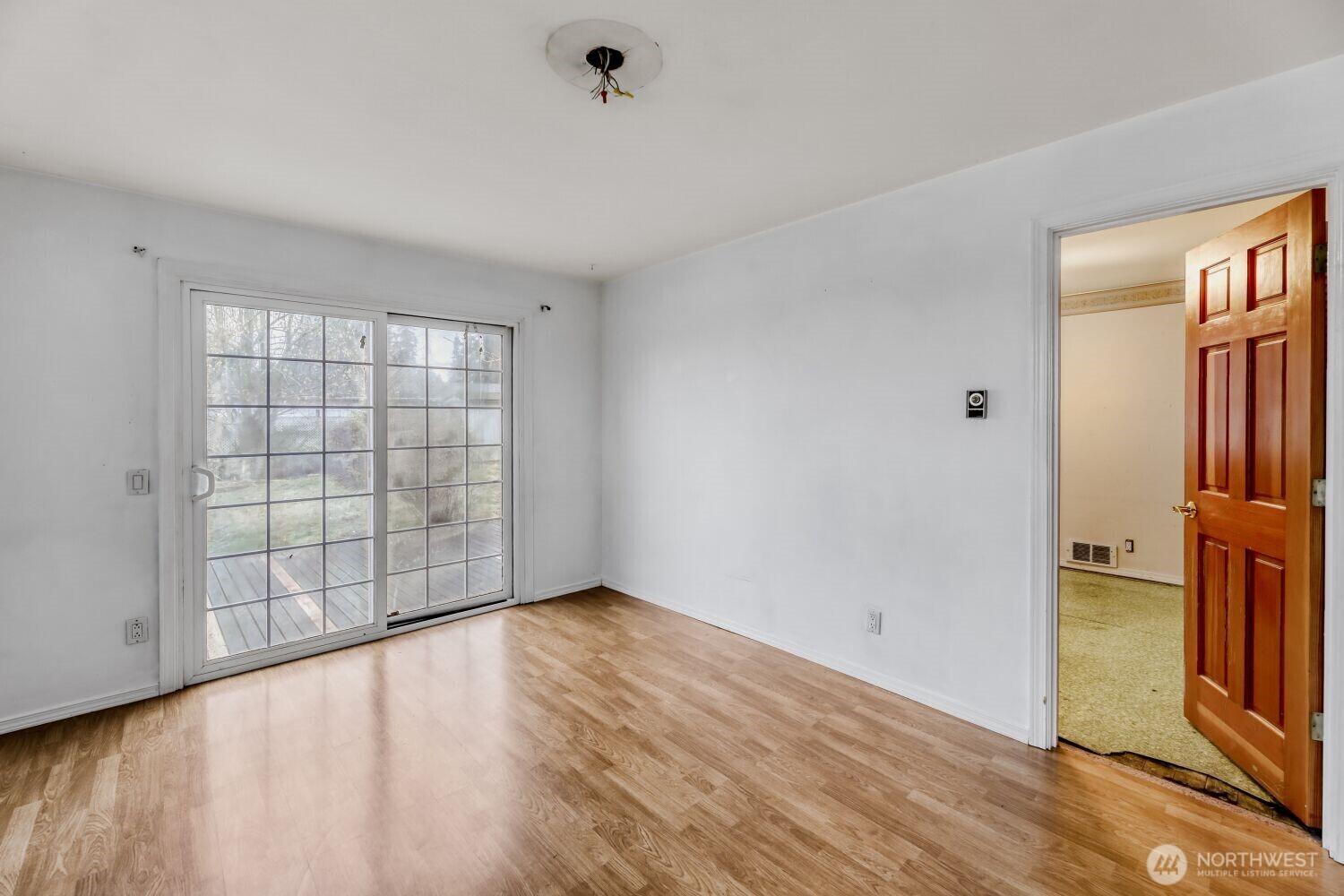 208 78th Place Southwest Everett, WA 98203 - Photo 17 of 36 an empty room with wooden floor and windows