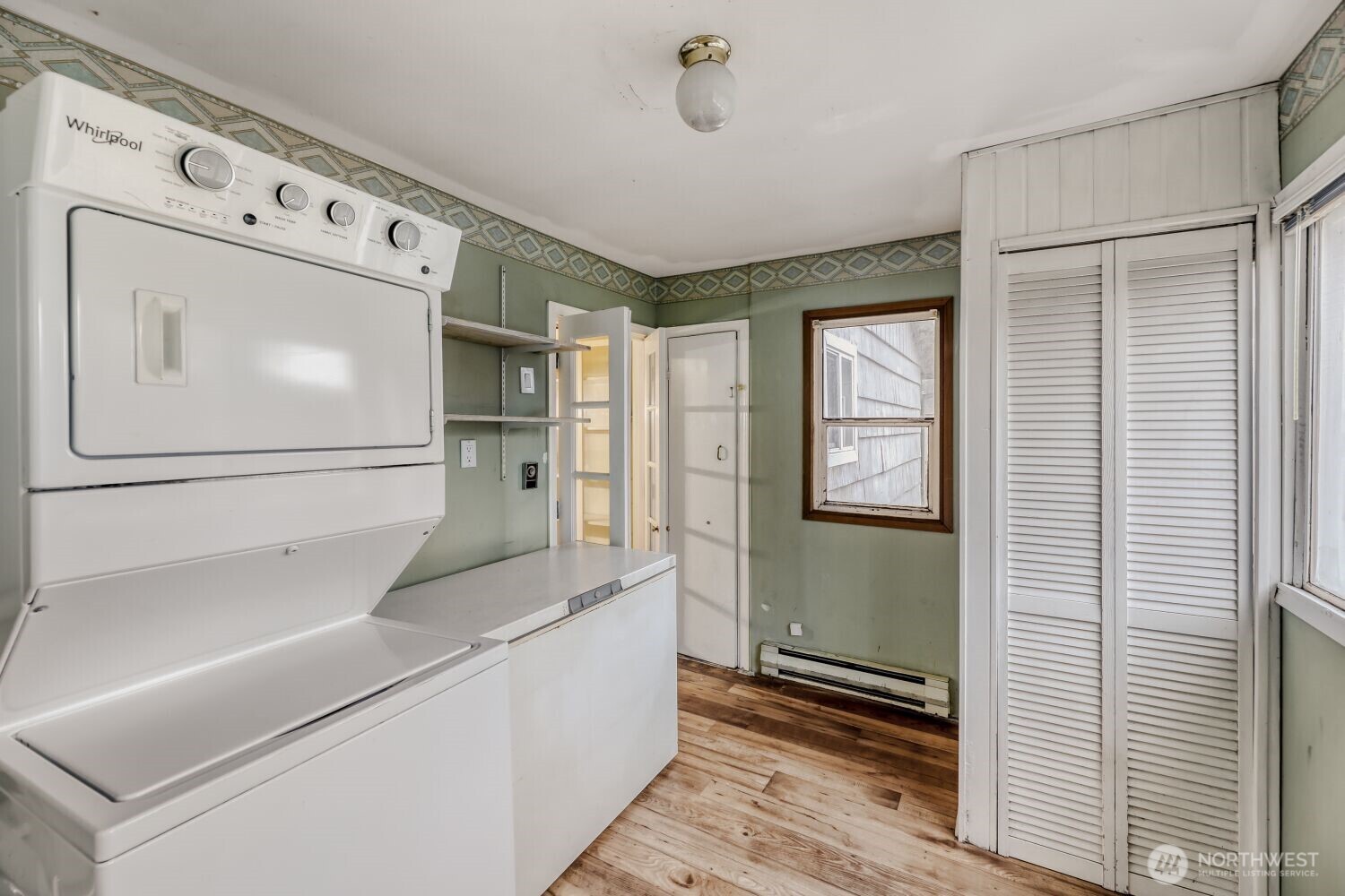 208 78th Place Southwest Everett, WA 98203 - Photo 24 of 36 a hallway with cabinets and wooden floor