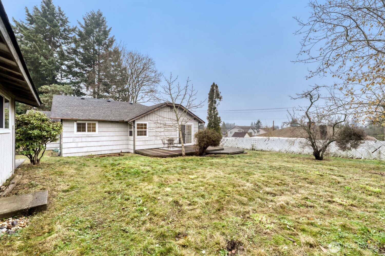 208 78th Place Southwest Everett, WA 98203 - Photo 7 of 36 a front view of a house with a yard