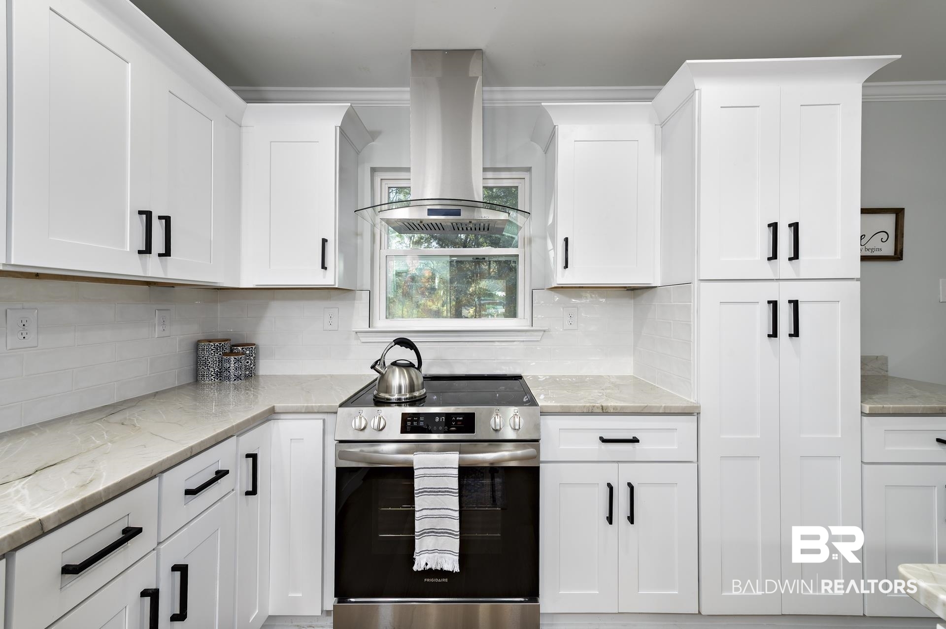 6001 Camp Halls Mill Road Mobile, AL 36619 - Photo 17 of 52 Kitchen featuring stainless steel electric stove, light stone counters, island range hood, white cabinetry, and ornamental molding