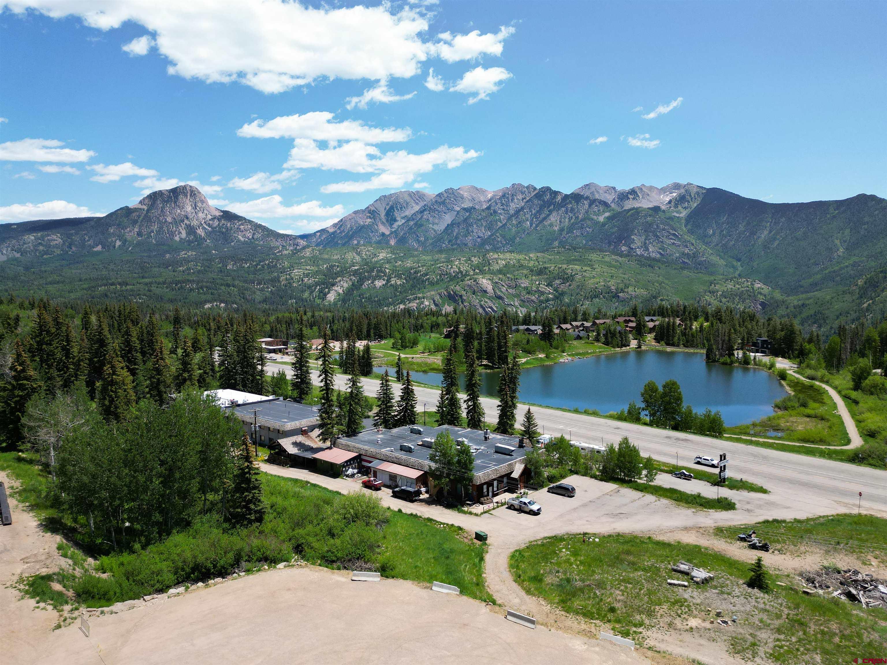 49617 Highway 550 Durango, CO 81301 - Photo 2 of 23 a view of a patio with lawn chairs under an umbrella