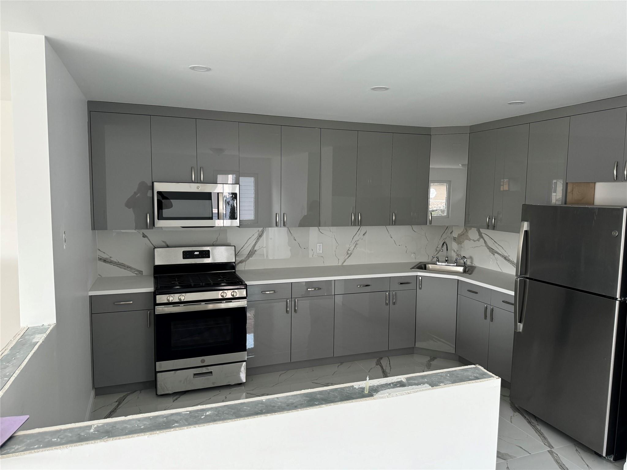 174 98th Beach Queens, NY 11694 - Photo 1 of 1 a kitchen with a refrigerator stove and microwave