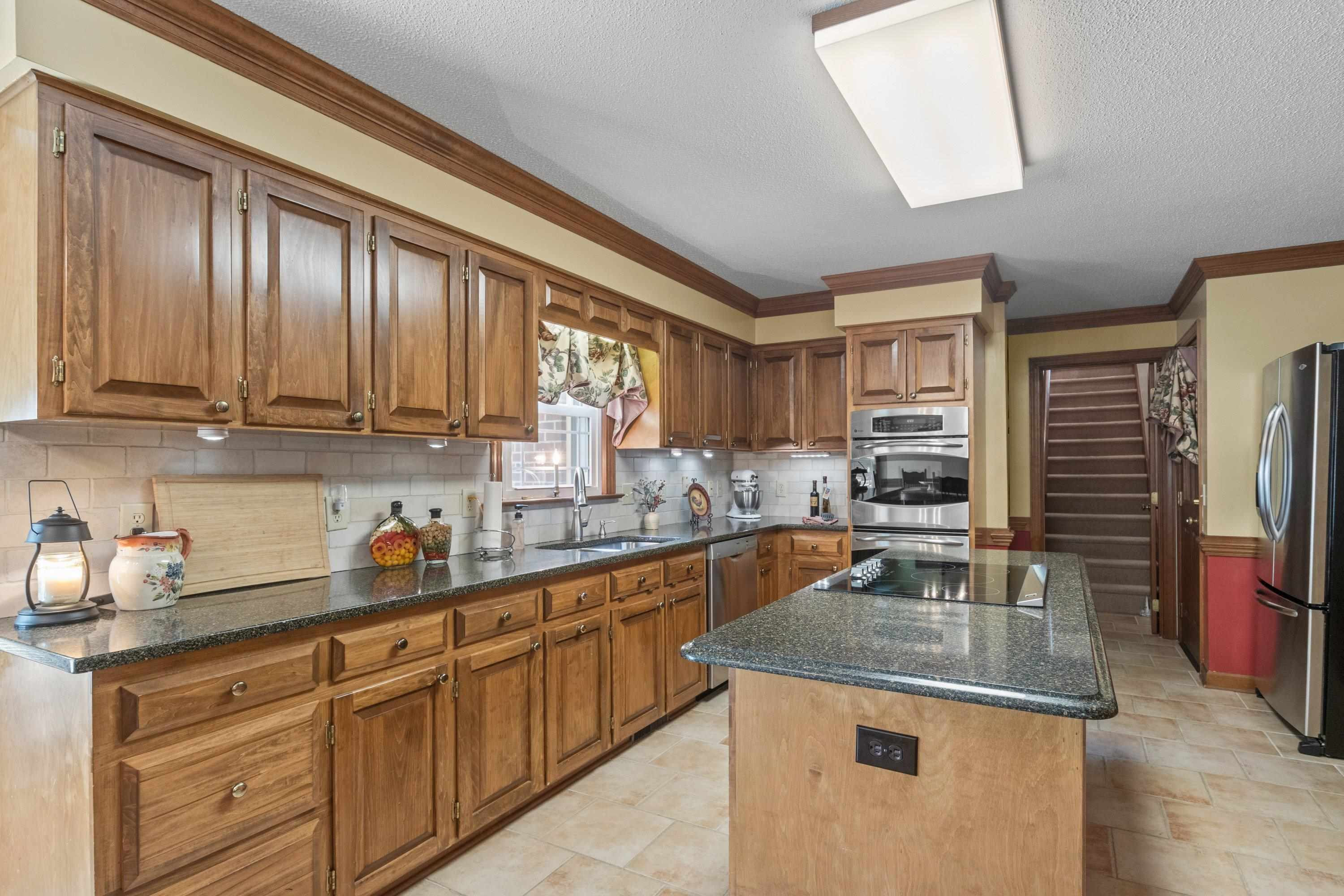 8501 Crowder Road Raleigh, NC 27603 - Photo 15 of 60 Frigidaire downdraft cooktop and double ovens Kitchen
