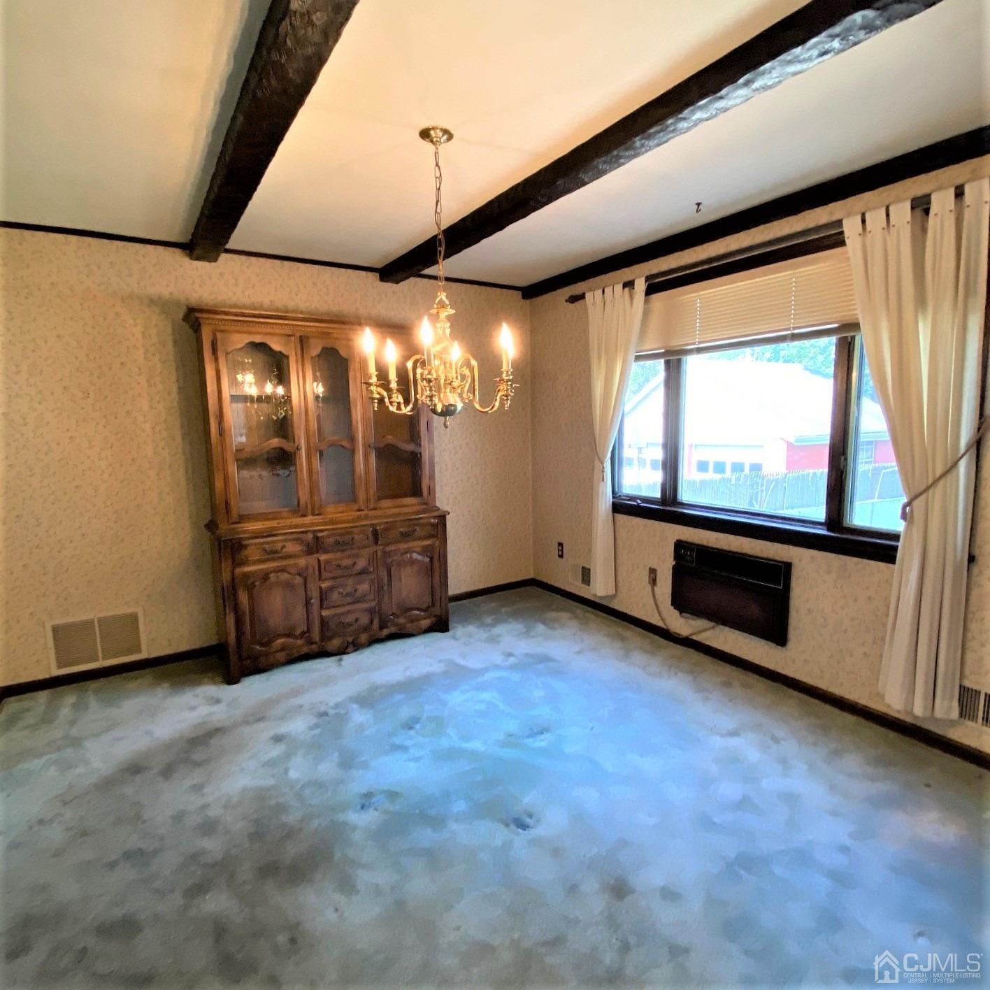 712 Center Street Dunellen, NJ 08812 - Photo 12 of 24 a view of an empty room with a window