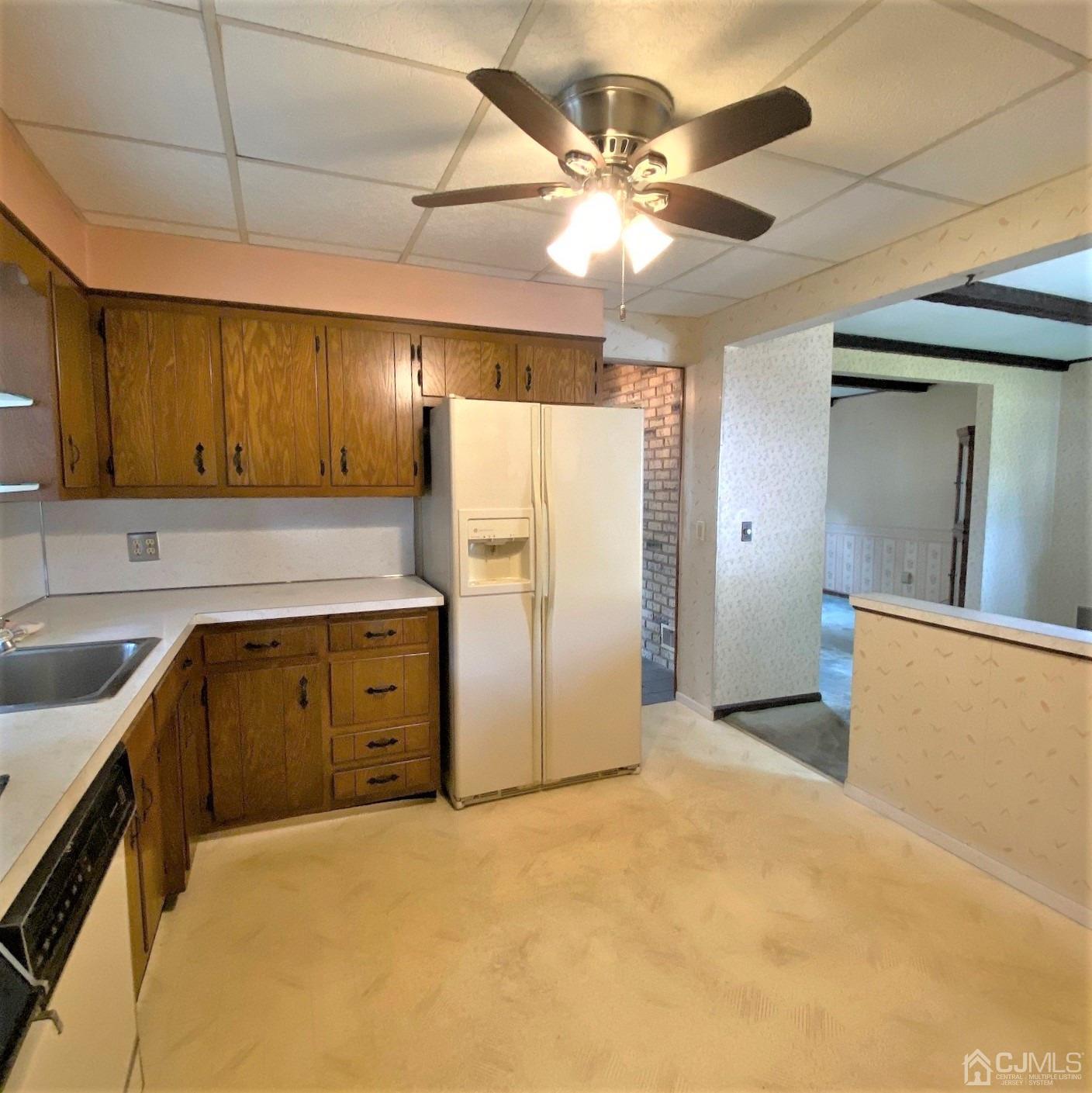 712 Center Street Dunellen, NJ 08812 - Photo 14 of 24 a kitchen with stainless steel appliances granite countertop a refrigerator and a sink