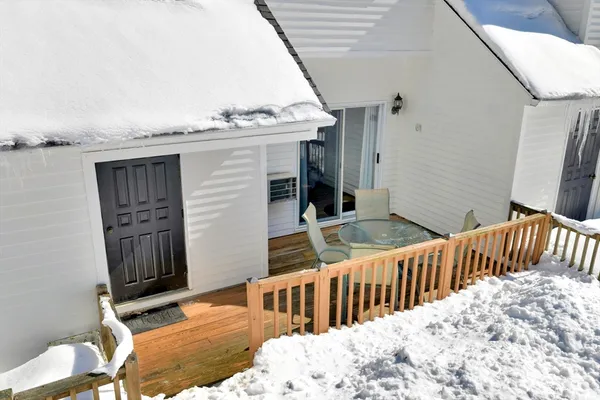 a view of balcony with furniture