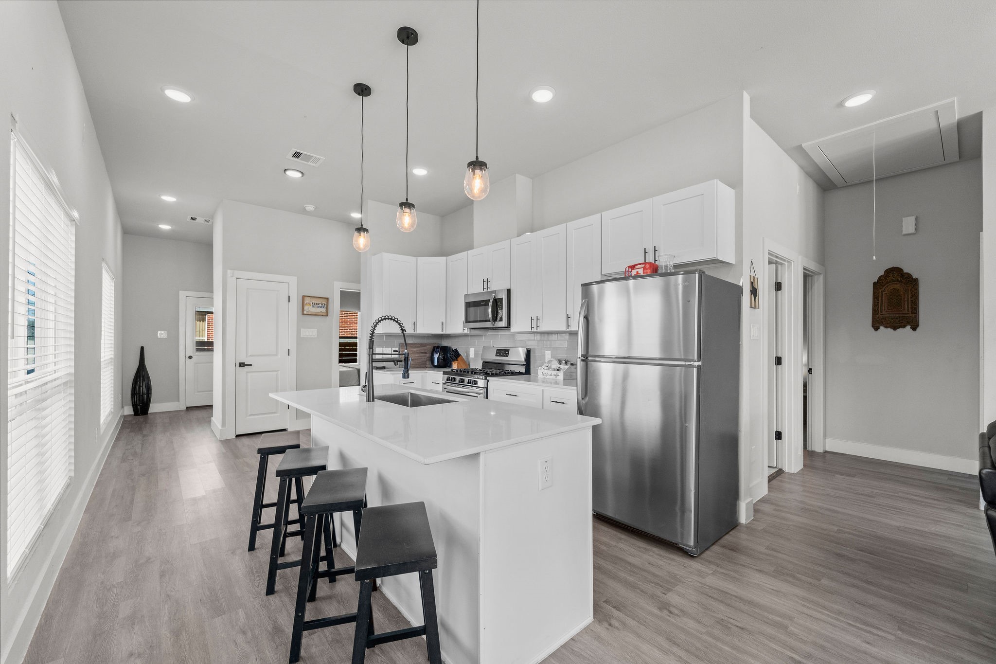 507 Carl Street Houston, TX 77009 - Photo 12 of 24 a kitchen with refrigerator a table and chairs