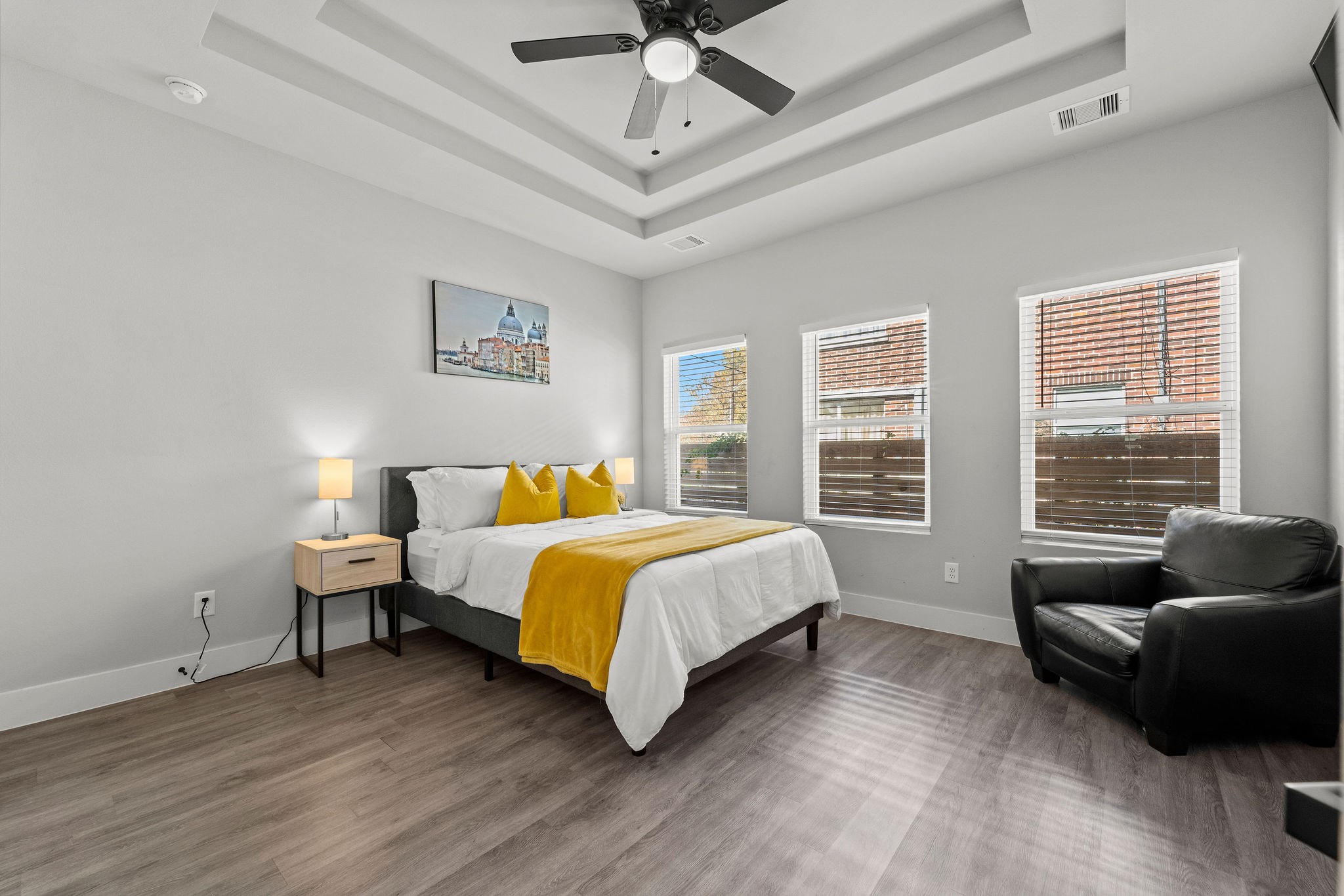 507 Carl Street Houston, TX 77009 - Photo 14 of 24 a spacious bedroom with a bed and couch