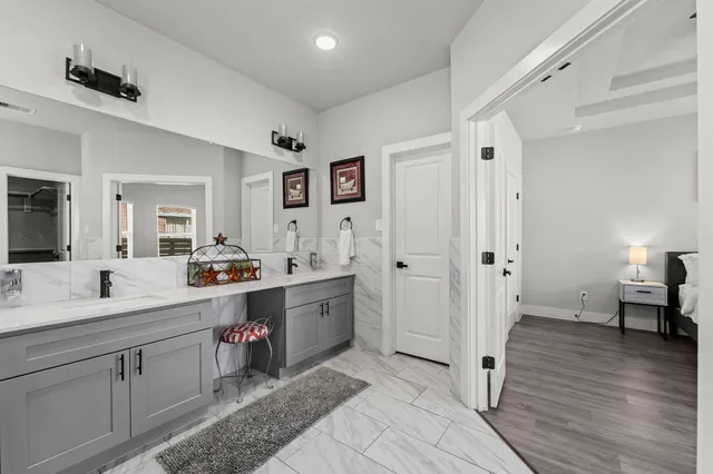 a bathroom with a sink and mirror
