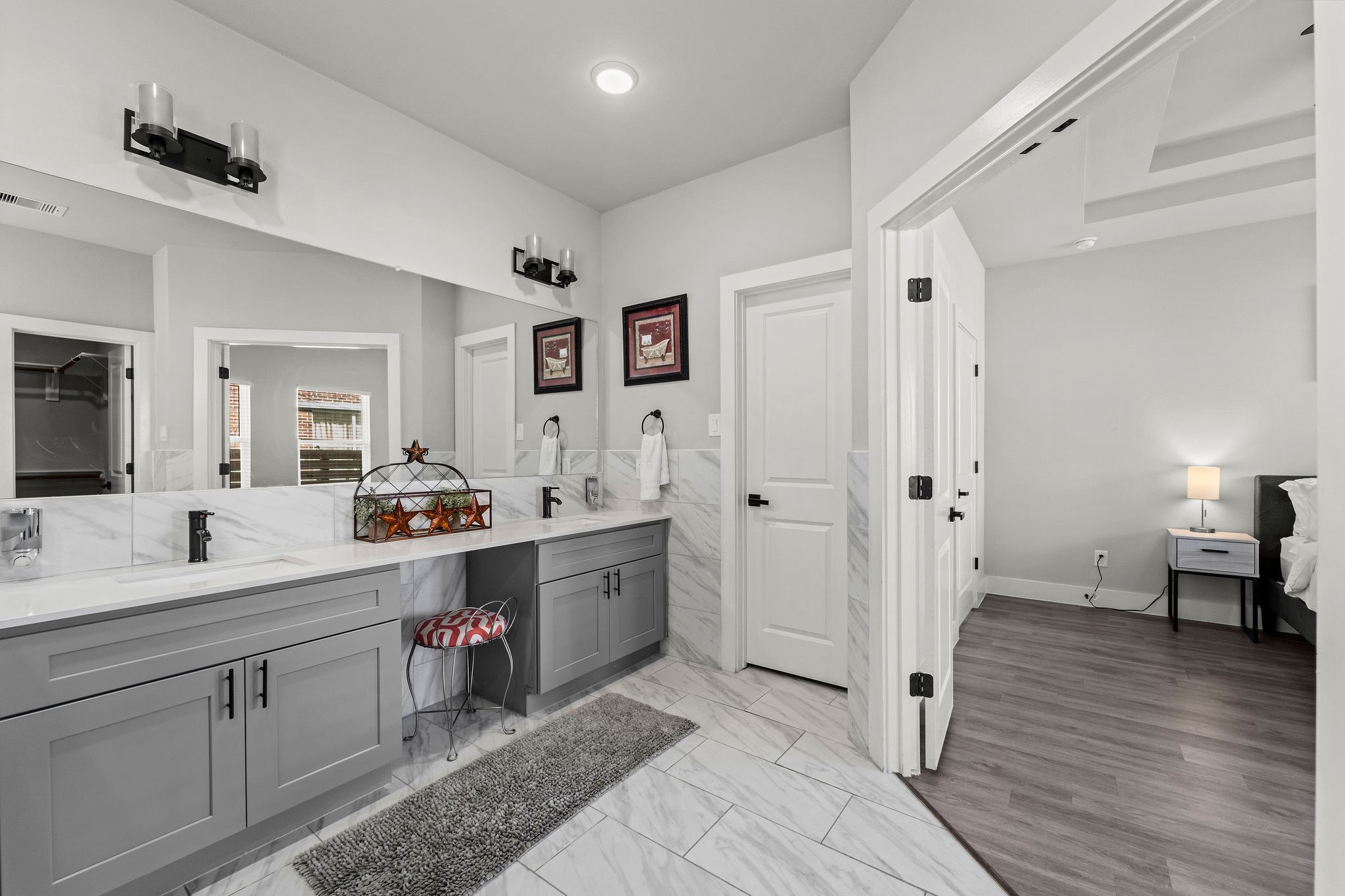507 Carl Street Houston, TX 77009 - Photo 18 of 24 a spacious bathroom with a double vanity sink and a mirror