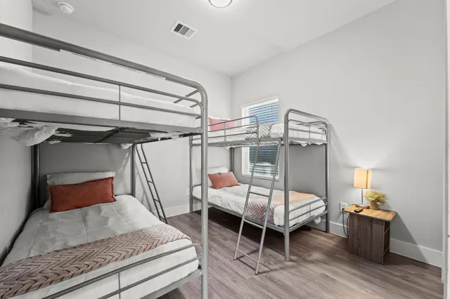 a spacious bathroom with a double vanity sink and a mirror