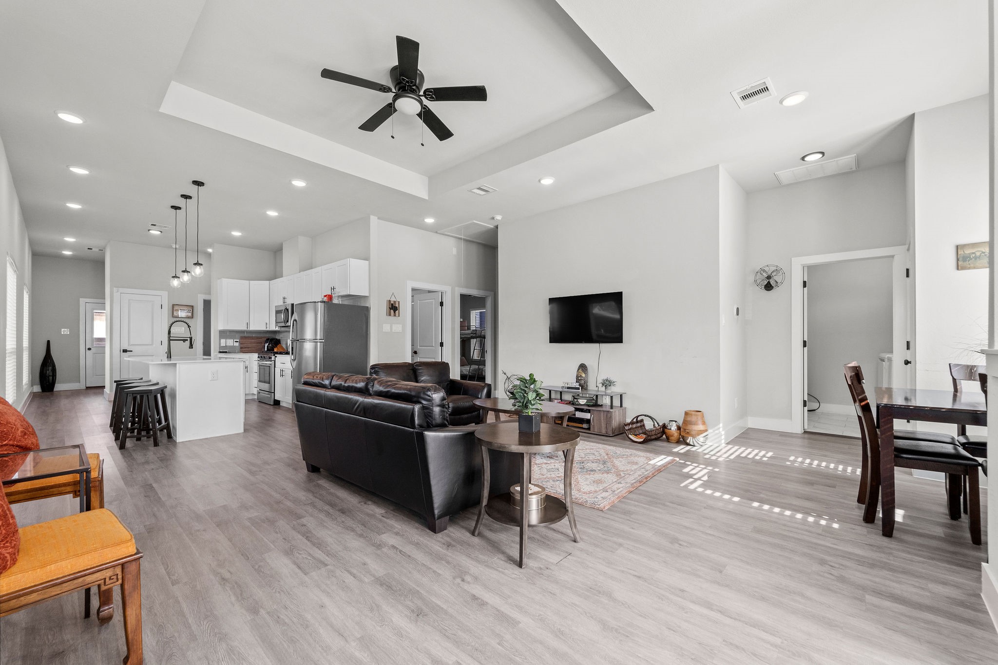 507 Carl Street Houston, TX 77009 - Photo 4 of 24 a living room with furniture kitchen view and a wooden floor