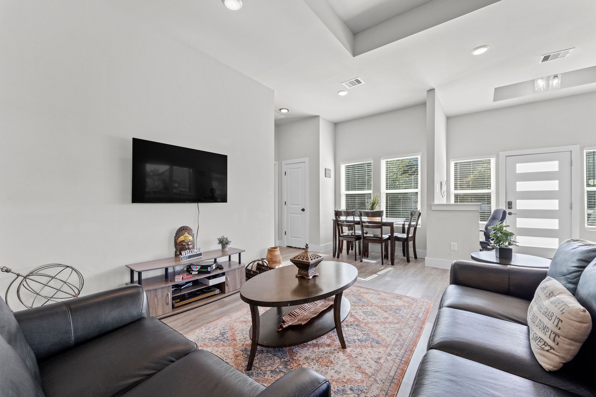 507 Carl Street Houston, TX 77009 - Photo 8 of 24 a living room with furniture a flat screen tv and large window