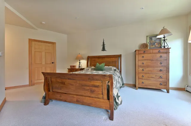 a room with a bed and furniture