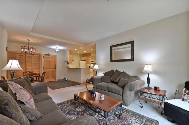a living room with furniture fireplace and a lamp