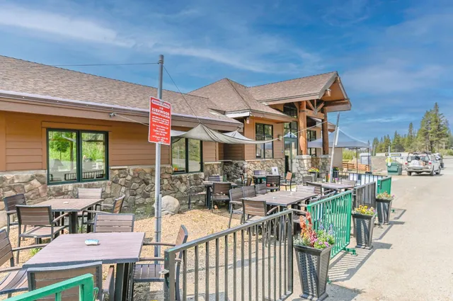a view of a chairs and table in patio