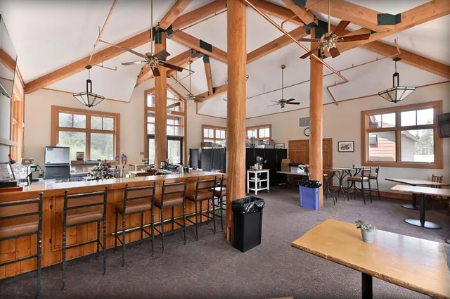 a room with lots of table and chairs