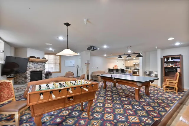a living room with furniture a table and chairs