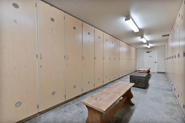 a view of a hallway with seating area