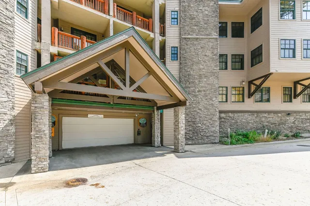 a front view of a house with garage