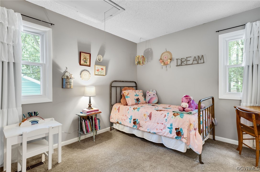 14218 Regatta Pointe Road Midlothian, VA 23112 - Photo 14 of 18 a bedroom with a bed and a table in it