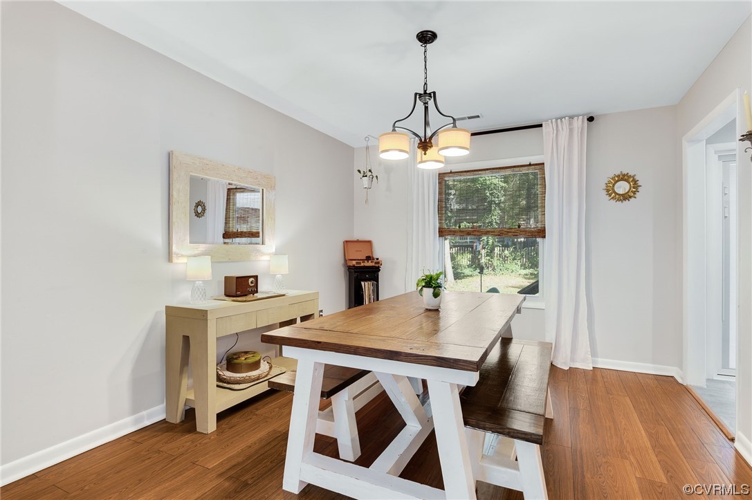 14218 Regatta Pointe Road Midlothian, VA 23112 - Photo 4 of 18 a view of a dining room with furniture window and wooden floor