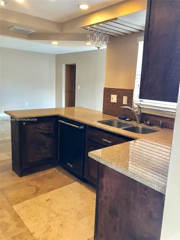 a view of kitchen with cabinets