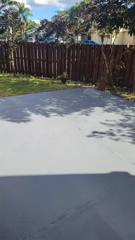 a view of a backyard of the house