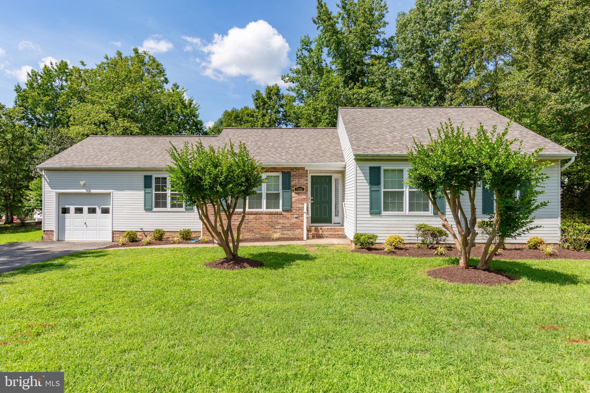 5705 Cascade Drive Fredericksburg, VA 22407 - Photo 1 of 32 a front view of a house with a yard and garage