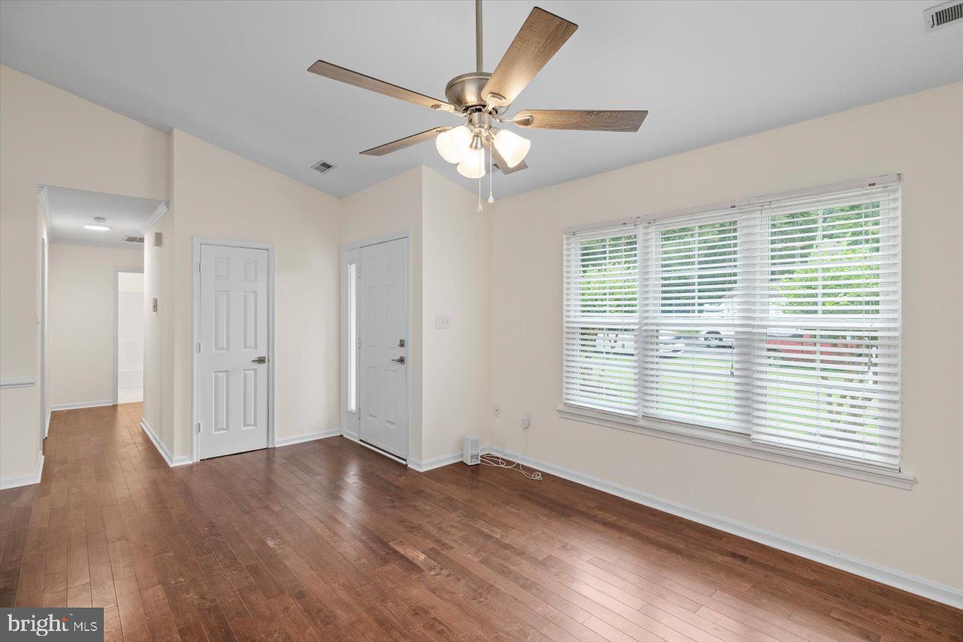 5705 Cascade Drive Fredericksburg, VA 22407 - Photo 17 of 32 a view of an empty room with wooden floor and a window