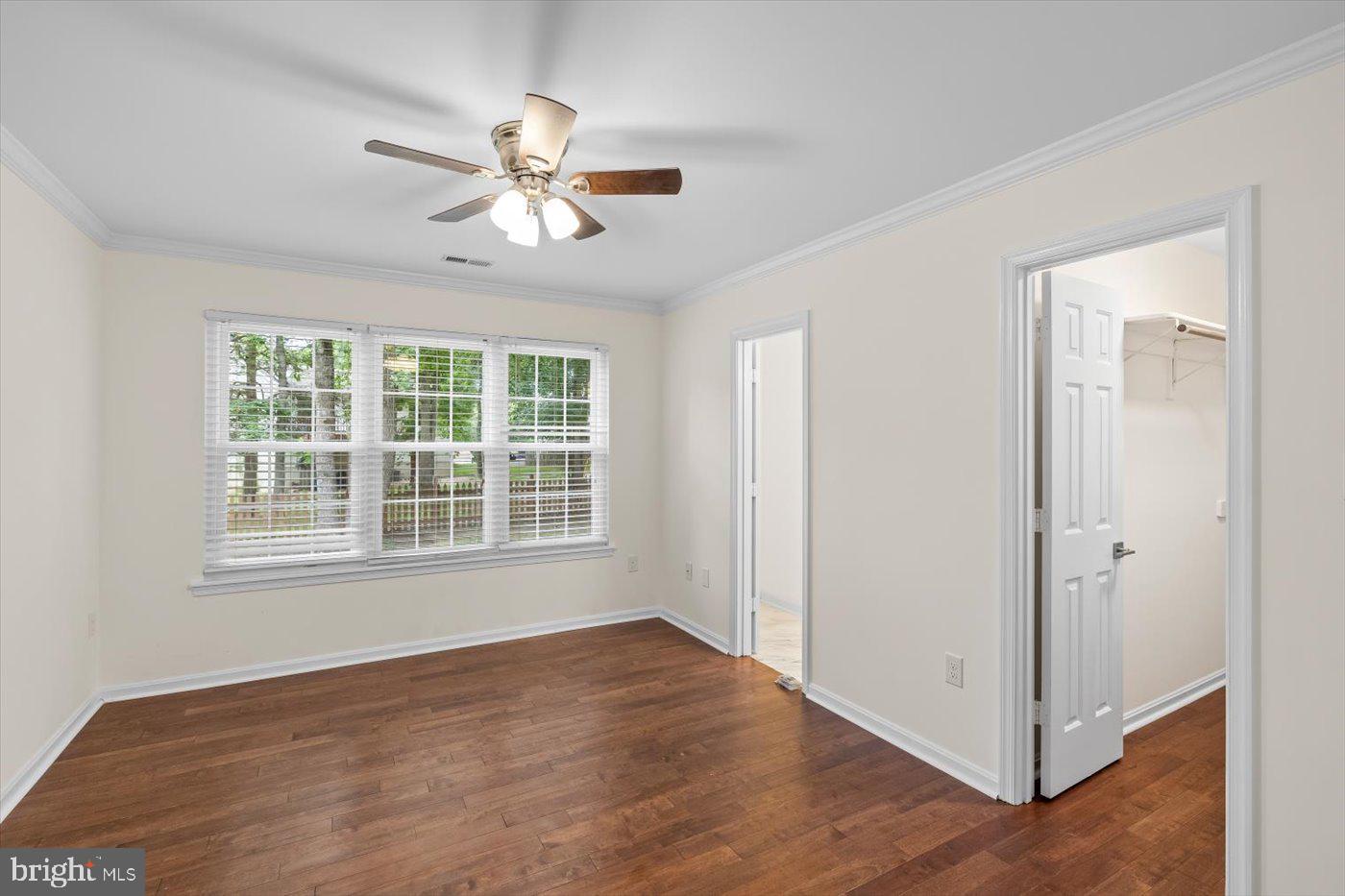 5705 Cascade Drive Fredericksburg, VA 22407 - Photo 18 of 32 a view of an empty room with wooden floor and a window