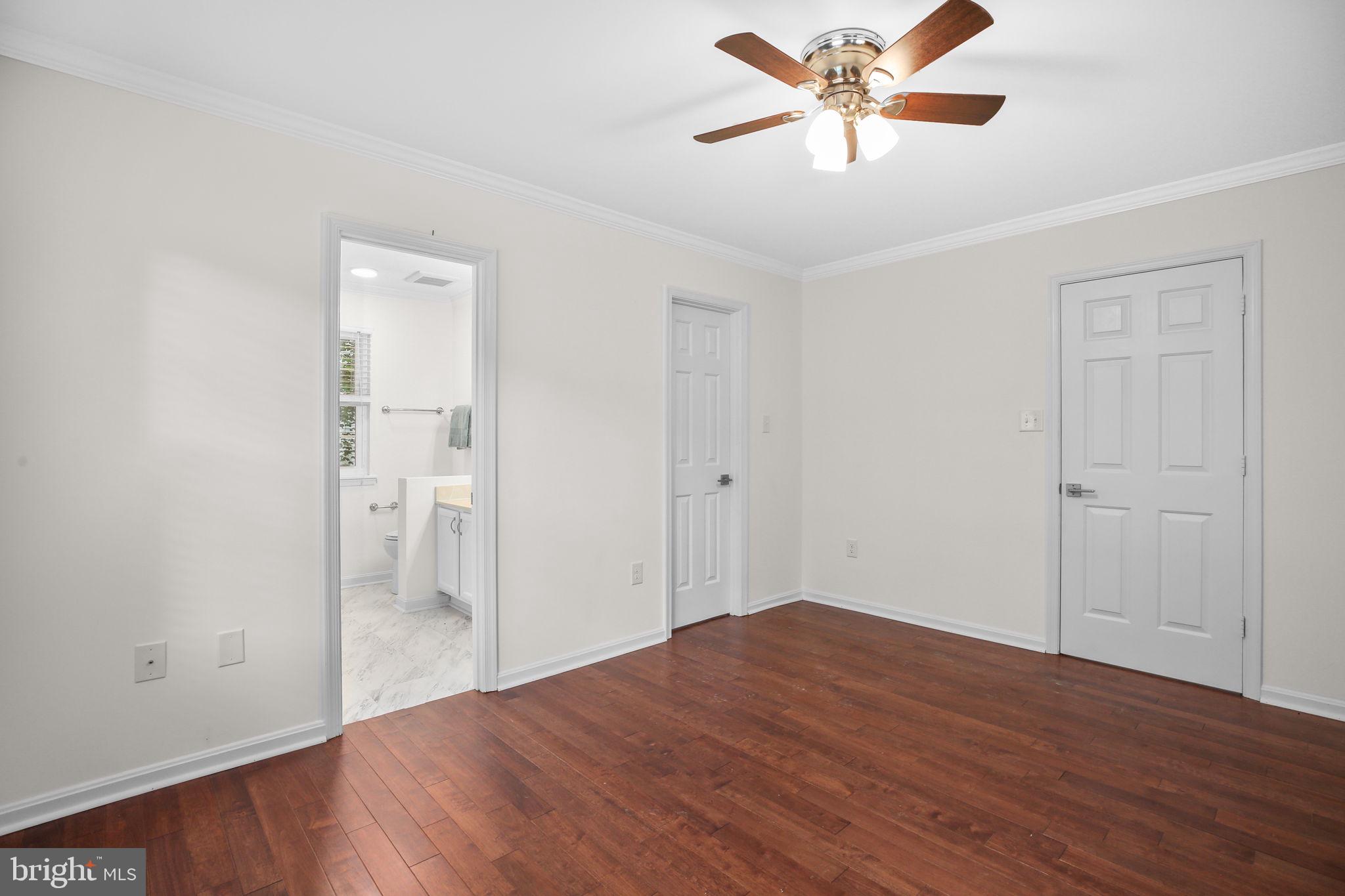 5705 Cascade Drive Fredericksburg, VA 22407 - Photo 22 of 32 a view of a livingroom with a ceiling fan and wooden floor