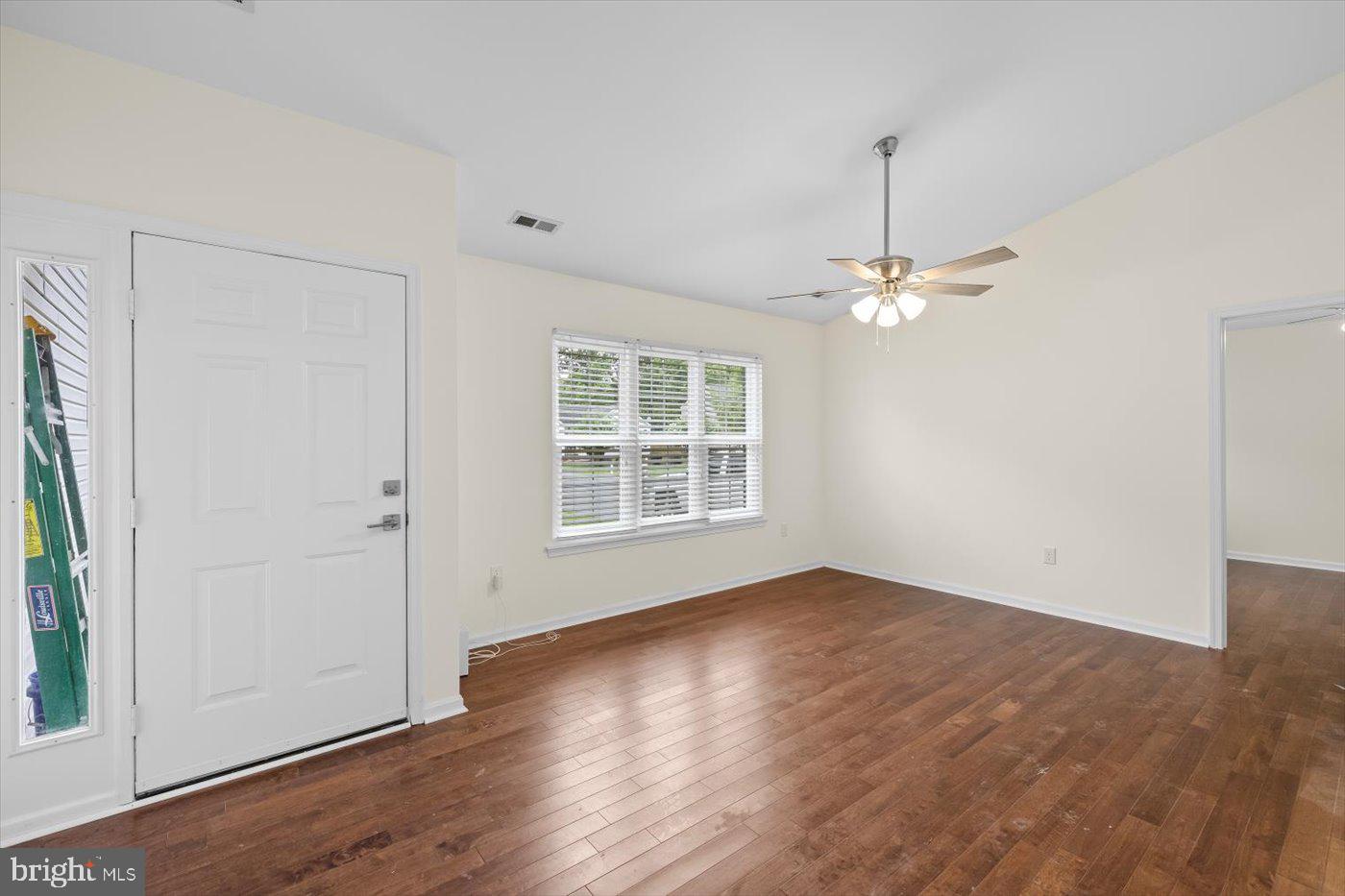 5705 Cascade Drive Fredericksburg, VA 22407 - Photo 5 of 32 an empty room with wooden floor and windows