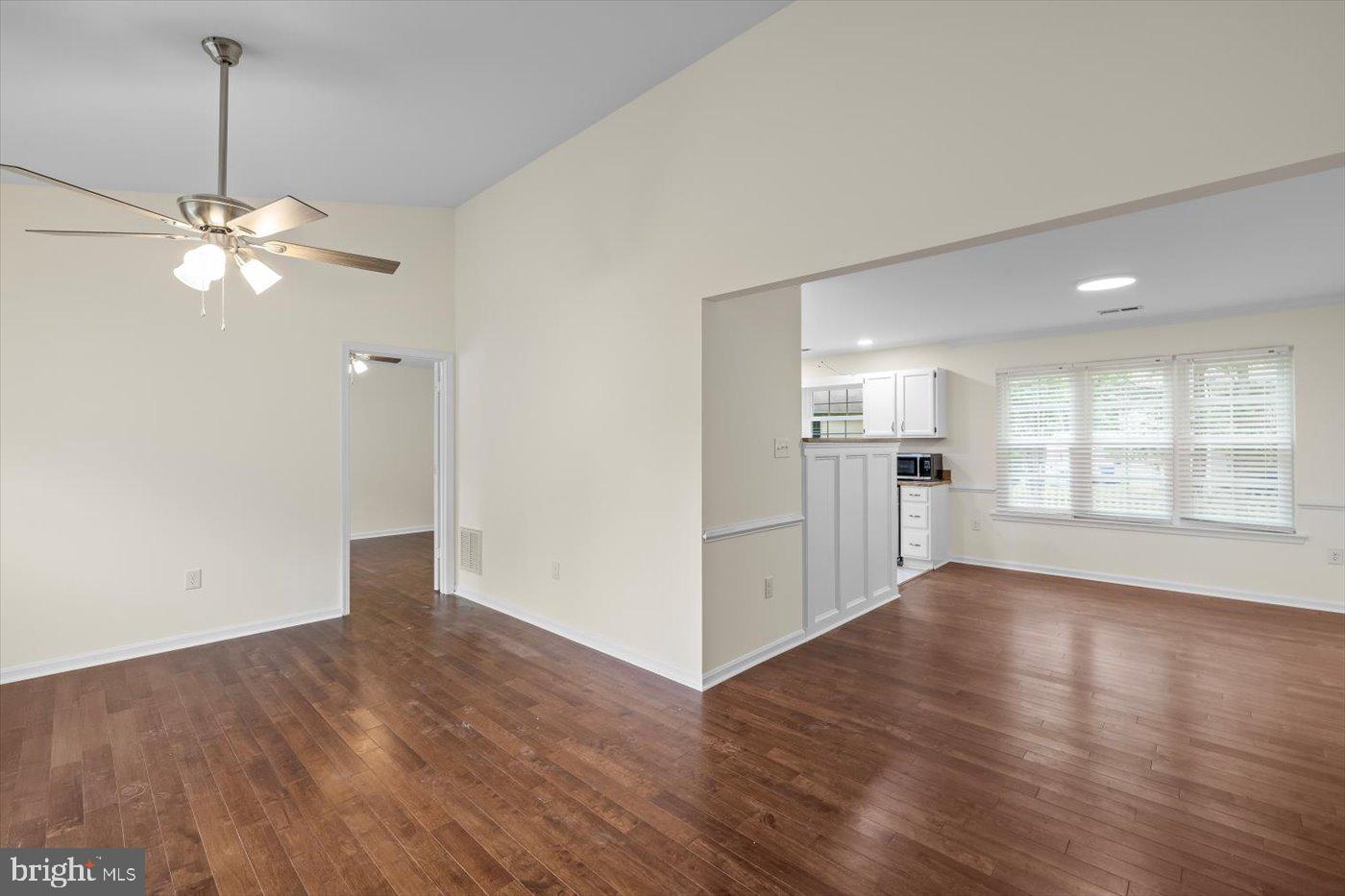 5705 Cascade Drive Fredericksburg, VA 22407 - Photo 6 of 32 a view of a big room with wooden floor and windows