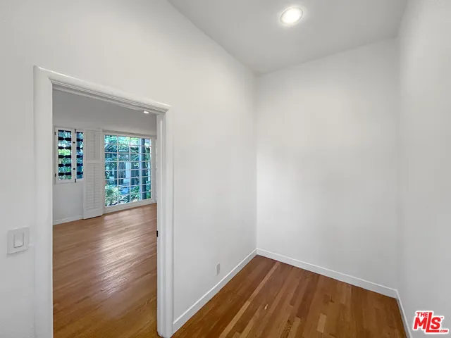 a view of a house with a tree