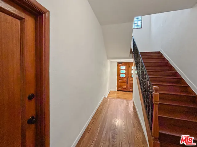 a view of parking garage with cars parked