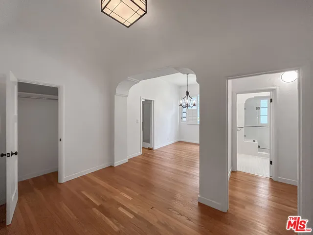 a kitchen with stainless steel appliances a sink stove and cabinets