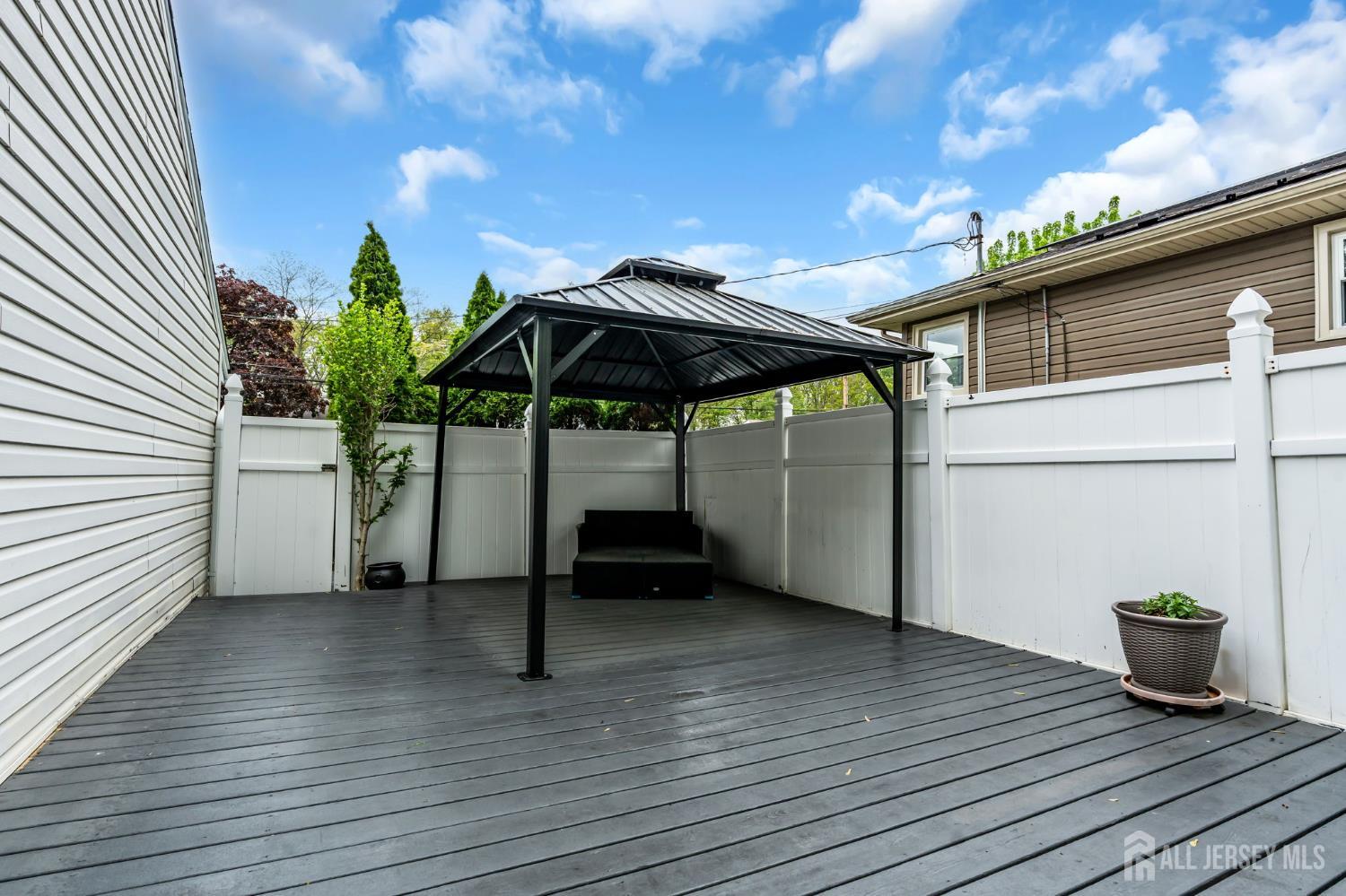 1010 Fordham Road Neptune, NJ 07753 - Photo 52 of 66 a view of a terrace with wooden floor and fence