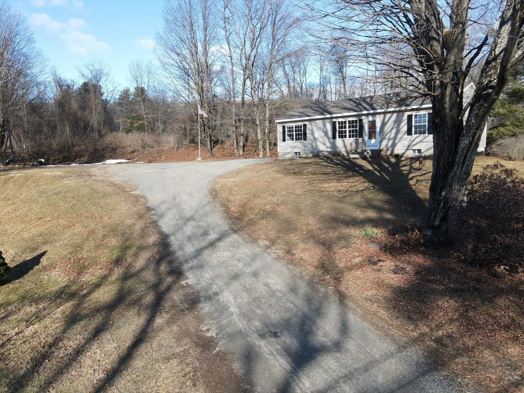 a view of house with yard