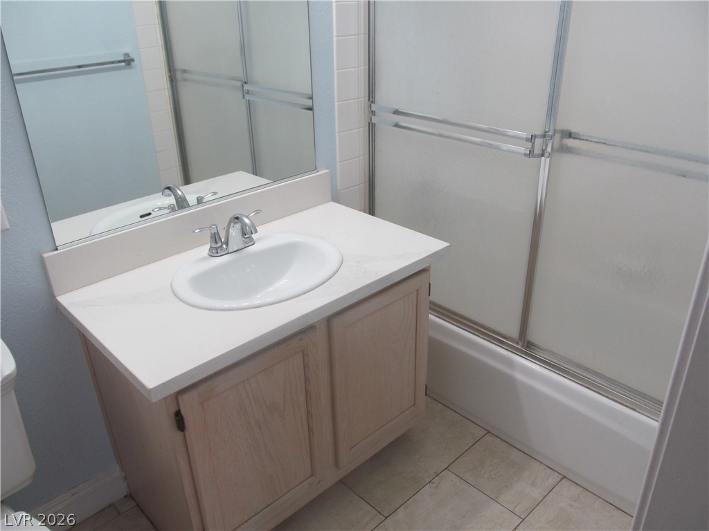 7950 West Flamingo Road, Unit 2048 Las Vegas, NV 89147 - Photo 21 of 24 A well-appointed bathroom features a single vanity and a shower-tub combination.