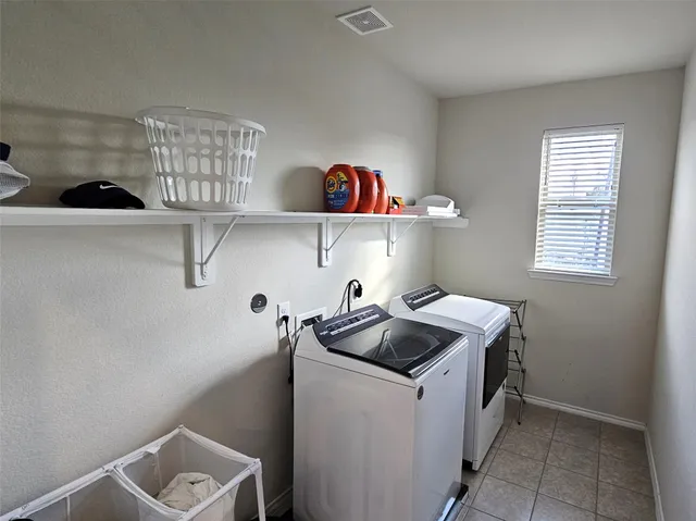 a kitchen with a cabinets and window