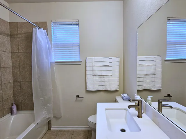 a bathroom with a sink a bathtub and a shower