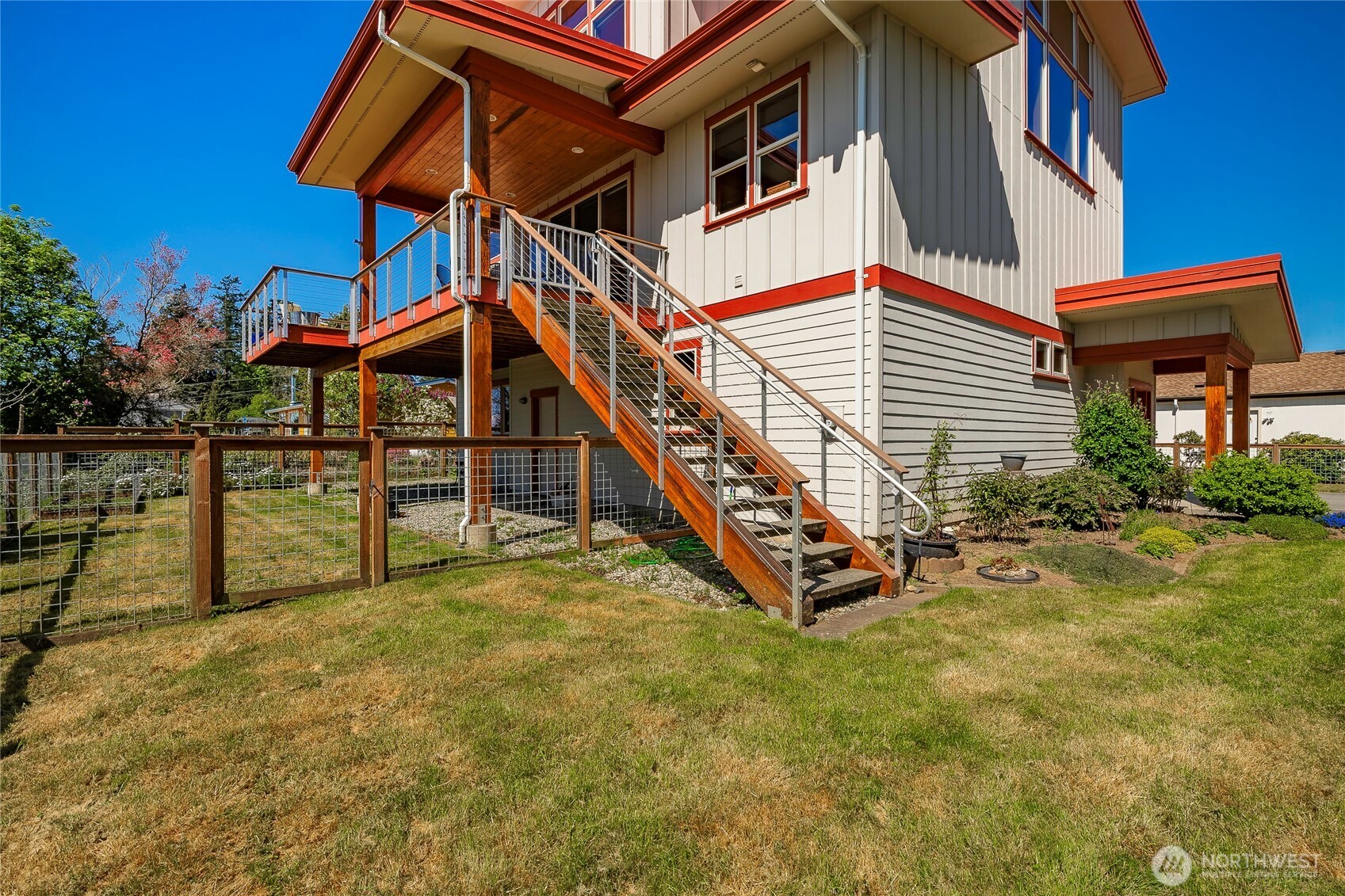 8285 Sunset Street Blaine, WA 98230 - Photo 11 of 38 a view of a house with backyard and deck
