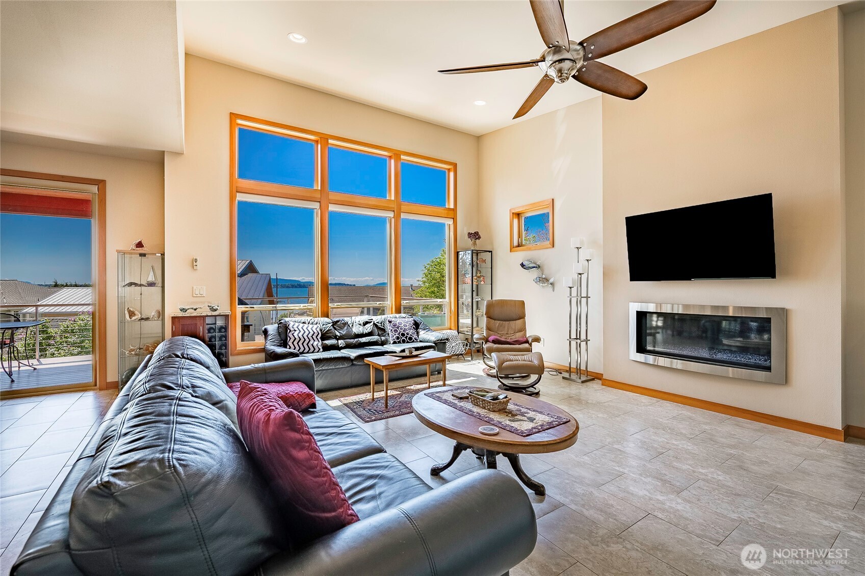 8285 Sunset Street Blaine, WA 98230 - Photo 15 of 38 a living room with fireplace furniture and a flat screen tv