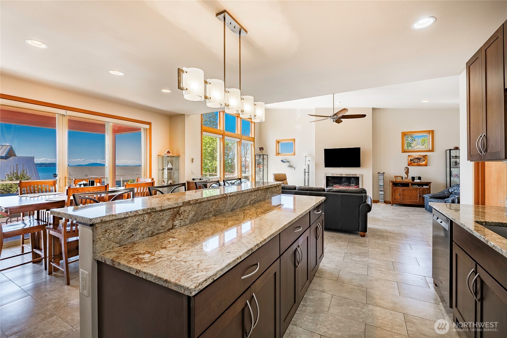8285 Sunset Street Blaine, WA 98230 - Photo 16 of 38 a large kitchen with kitchen island a large counter top appliances and a center island