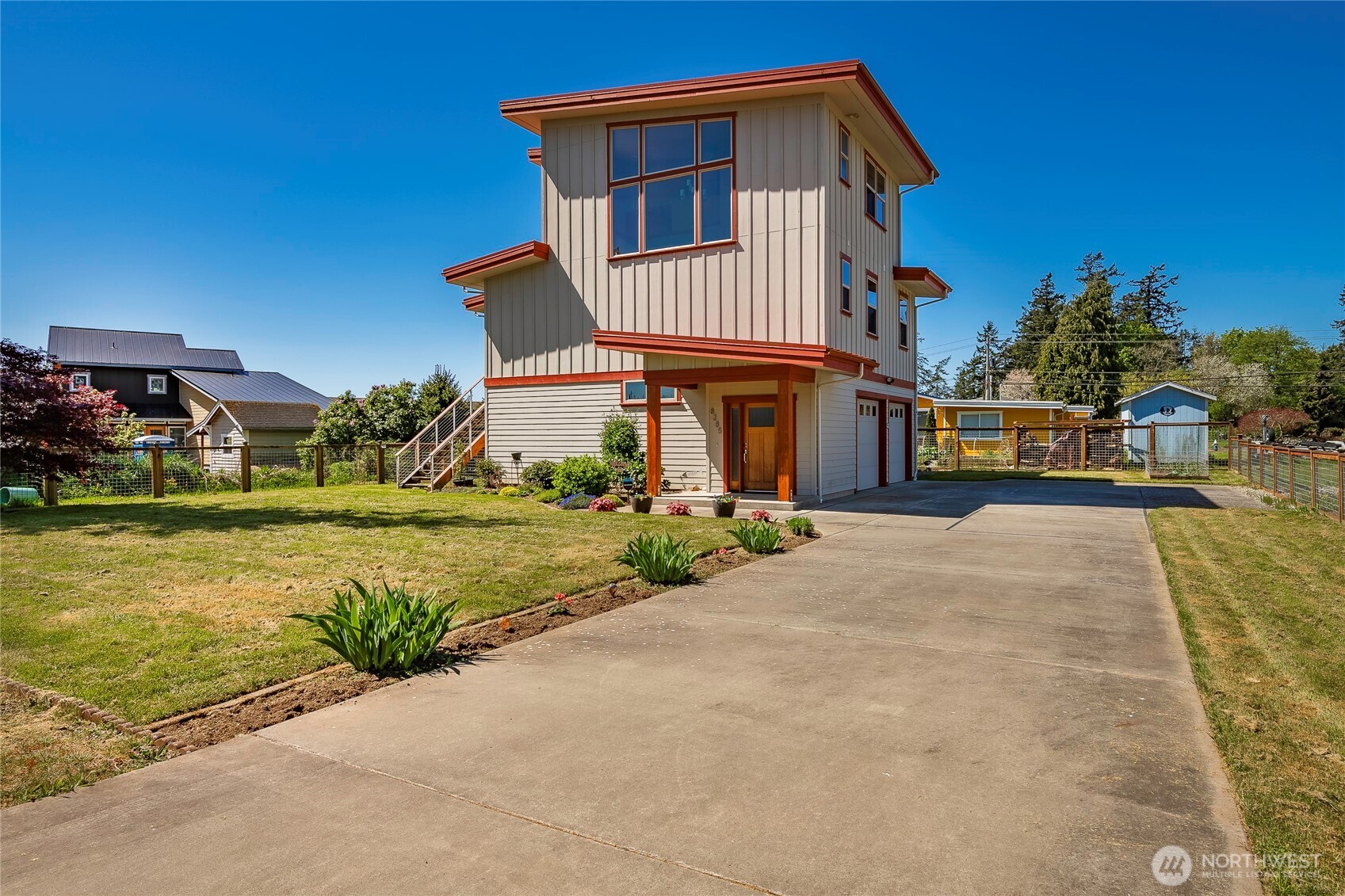 8285 Sunset Street Blaine, WA 98230 - Photo 2 of 38 a front view of a house with swimming pool having outdoor seating