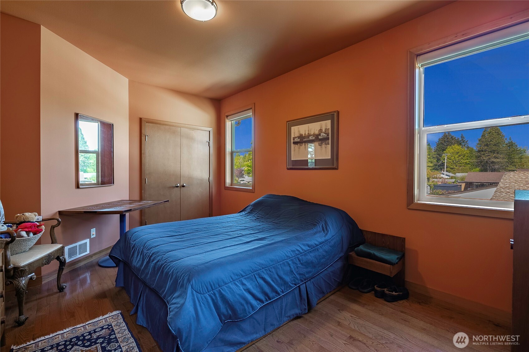 8285 Sunset Street Blaine, WA 98230 - Photo 28 of 38 a bedroom with a bed and a table in it